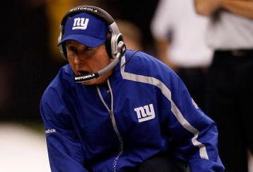 NEW ORLEANS - OCTOBER 18:  Head coach Tom Coughlin of the New York Giants pulls out the red challenge flag from his sock during the game against the New Orleans Saints at the Louisiana Superdome on October 18, 2009 in New Orleans, Louisiana.  (Photo by Chris Graythen/Getty Images)
