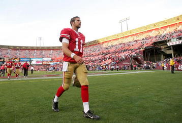 SAN FRANCISCO - NOVEMBER 08:  Alex Smith #11 of the San Francisco 49ers walks off the field after their loss to the Tennessee Titans at Candlestick Park on November 8, 2009 in San Francisco, California.  (Photo by Ezra Shaw/Getty Images)