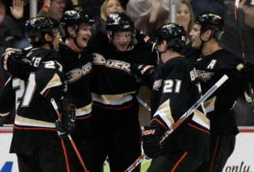 ANAHEIM, CA - NOVEMBER 03:  (L-R) Scott Niedermayer #27, Corey Perry #10, Bobby Ryan #9, Sheldon Brookbank #21 and Ryan Getzlaf #15 of the Anaheim Ducks celebrate Perry's second period goal against the Pittsburgh Penguins at the Honda Center on November 3, 2009 in Anaheim, California.  (Photo by Jeff Gross/Getty Images)