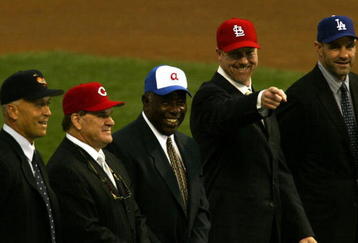 SAN FRANCISCO - OCTOBER 23: (L-R)  Cal Ripken Jr., Pete Rose, Hank Aaron, Mark McGwire and Kirk Gibson stand together during the MLB Ten Most Memorable Moments ceremony before the start of game four of the World Series between the San Francisco Giants and the Anaheim Angels on October 23, 2002 at Pacific Bell Park in San Francisco, California. Cal Ripken Jr. was voted number one. (Photo by Brian Bahr/Getty Images) 