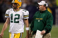 MINNEAPOLIS - NOVEMBER 09: Quarterback Aaron Rodgers #12 and head coach Mike McCarthy of the Green Bay Packers confer against the Minnesota Vikings on November 9, 2008 at the Metrodome in Mineapolis, Minnesota. The Vikings won 28-27. (Photo by Stephen Dunn/Getty Images)