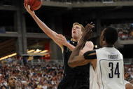 GLENDALE, AZ - MARCH 26: Forward Robbie Hummel #4 of the Purdue Boilermakers takes a shot against the Connenticut Huskies in the Sweet 16 of the NCAA Division I Men's Basketball Tournament at the University of Phoenix Stadium on March 26, 2009 in Glendale, Arizona. (Photo by Ronald Martinez/Getty Images)