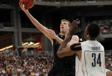 GLENDALE, AZ - MARCH 26:  Forward Robbie Hummel #4 of the Purdue Boilermakers takes a shot against the Connenticut Huskies in the Sweet 16 of the NCAA Division I Men's Basketball Tournament at the University of Phoenix Stadium on March 26, 2009 in Glendale, Arizona.  (Photo by Ronald Martinez/Getty Images)