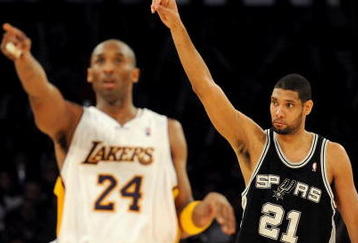 LOS ANGELES, CA - JANUARY 25:  Tim Duncan #21 of the San Antonio Spurs reacts to a foul next to Kobe Bryant #24 of the Los Angeles Lakers during the forth quarter at the Staples Center on January 25, 2009 in Los Angeles, California.  The Lakers defeated the Spurs 99-85.  NOTE TO USER:  User expressly acknowledges and agrees that, by downloading and/or using this photograph, User is consenting to the terms and conditions of the Getty Images License Agreement.  (Photo by Harry How/Getty Images)