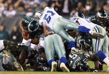 PHILADELPHIA - NOVEMBER 08:  Donovan McNabb #5 of the Philadelphia Eagles is stopped on a 4 and 1 play in the fourth quarter against Keith Brooking #51 of the Dallas Cowboys at Lincoln Financial Field on November 8, 2009 in Philadelphia, Pennsylvania.  (Photo by Al Bello/Getty Images)