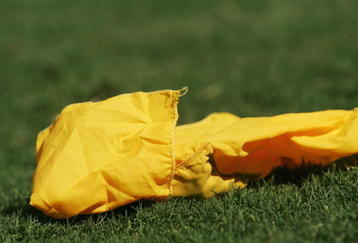 DALLAS - OCTOBER 7:  Detail of the yellow flag thrown by a referee during the Red River Shootout between the Texas Longhorns and the Oklahoma Sooners at the Cotton Bowl on October 7, 2006 in Dallas, Texas. The Longhorns won 28-10. (Photo by Ronald Martinez/Getty Images)