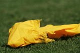 DALLAS - OCTOBER 7:  Detail of the yellow flag thrown by a referee during the Red River Shootout between the Texas Longhorns and the Oklahoma Sooners at the Cotton Bowl on October 7, 2006 in Dallas, Texas. The Longhorns won 28-10. (Photo by Ronald Martinez/Getty Images)