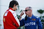BUDAPEST, HUNGARY - JULY 25: F.I.A. doctor Gary Hartstein talks with a Ferrari team member following qualifying for the Hungarian Formula One Grand Prix at the Hungaroring on July 25, 2009 in Budapest, Hungary. (Photo by Paul Gilham/Getty Images)