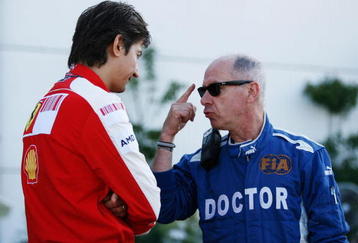 BUDAPEST, HUNGARY - JULY 25:  F.I.A. doctor Gary Hartstein talks with a Ferrari team member following qualifying for the Hungarian Formula One Grand Prix at the Hungaroring on July 25, 2009 in Budapest, Hungary.  (Photo by Paul Gilham/Getty Images)