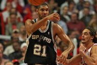 CHICAGO - OCTOBER 29: Tim Duncan #21 of the San Antonio Spurs passes the ball under pressure from Joakim Noah #13 of the Chicago Bulls at the United Center on October 29, 2009 in Chicago, Illinois. The Bulls defeated the Spurs 92-85. (Photo by Jonathan Daniel/Getty Images)