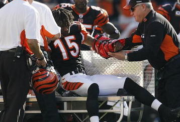 CINCINNATI - NOVEMBER 8: Chris Henry #15 of the Cincinnati Bengals is taken off the field with a left arm injury after being tackled by Lardarius Webb #21 of the Baltimore Ravens at Paul Brown Stadium on November 8, 2009 in Cincinnati, Ohio.  (Photo by John Sommers II/Getty Images)