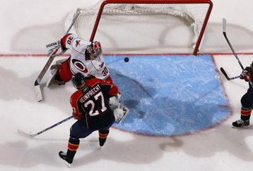 SUNRISE, FL - NOVEMBER 4: Steven Reinprecht #27 of the Florida Panthers scores a goal past goaltender Cam Ward #30 of the Carolina Hurricanes in the third period on November 4, 2009 at the BankAtlantic Center in Sunrise, Florida. The Panthers defeated the Hurricanes 3-0. (Photo by Joel Auerbach/Getty Images)