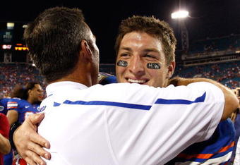JACKSONVILLE, FL - OCTOBER 31:  Head coach Urban Meyer hugs quarterback Tim Tebow #15 of the Florida Gators after their 41-17 win over the Georgia Bulldogs at Jacksonville Municipal Stadium on October 31, 2009 in Jacksonville, Florida.  (Photo by Kevin C. Cox/Getty Images)