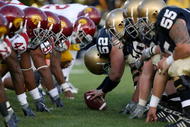 SOUTH BEND, IN - OCTOBER 17:  Braxston Cave #52 of the Notre Dame Fighting Irish prepares to snap the ball against the USC Trojans during the second quarter at Notre Dame Stadium on October 17, 2009 in South Bend, Indiana. (Photo by Jonathan Daniel/Getty Images)