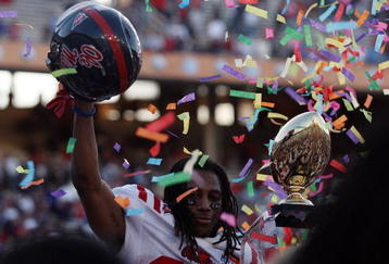 DALLAS - JANUARY 02:  Dexter McCluster #22 of the Mississippi Rebels celebrates a 47-34 win against the Texas Tech Red Raiders during the AT&T Cotton Bowl on January 2, 2009 at the Cotton Bowl in Dallas, Texas.  (Photo by Ronald Martinez/Getty Images)