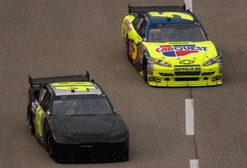 FORT WORTH, TX - NOVEMBER 08:  Jimmie Johnson, driver of the #48 Lowe's Chevrolet, races Mark Martin, driver of the #5 CARQUEST/Kellogg's Chevrolet, during the NASCAR Sprint Cup Series Dickies 500 at Texas Motor Speedway on November 8, 2009 in Fort Worth, Texas.  (Photo by Chris Graythen/Getty Images)