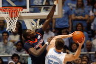 CHAPEL HILL, NC - FEBRUARY 07: Assane Sene #5 of the Virginia Cavaliers defends against Tyler Hansbrough #50 of the North Carolina Tar Heels on February 7, 2009 at the Dean E. Smith Center in Chapel Hill, North Carolina. (Photo by Kevin C. Cox/Getty Images)
