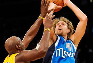 LOS ANGELES, CA - OCTOBER 30:  Dirk Nowitzki #41 of the Dallas Mavericks scores on a jumper against Lamar Odom #7 of the Los Angeles Lakers during the fourth quarter of the NBA basketball game at Staples Center on October 30, 2009 in Los Angeles, California.  NOTE TO USER: User expressly acknowledges and agrees that, by downloading and/or using this Photograph, user is consenting to the terms and conditions of the Getty Images License Agreement.  (Photo by Kevork Djansezian/Getty Images)