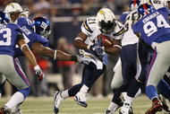 EAST RUTHERFORD, NJ - NOVEMBER 08: LaDainian Tomlinson #21 of the San Diego Chargers rushes against the New York Giants at Giants Stadium on November 8, 2009 in East Rutherford, New Jersey. (Photo by Nick Laham/Getty Images)