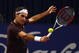 BASEL, SWITZERLAND - NOVEMBER 08:  Roger Federer of Switzerland plays a backhand in his match against Novak Djokovic of Serbia in the final during Day Seven of the Davidoff Swiss Indoors Tennis at St Jakobshalle on November 8, 2009 in Basel, Switzerland.  (Photo by Julian Finney/Getty Images)