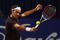 BASEL, SWITZERLAND - NOVEMBER 08:  Roger Federer of Switzerland plays a backhand in his match against Novak Djokovic of Serbia in the final during Day Seven of the Davidoff Swiss Indoors Tennis at St Jakobshalle on November 8, 2009 in Basel, Switzerland.  (Photo by Julian Finney/Getty Images)