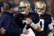 SOUTH BEND, IN - OCTOBER 17: Head coach Charlie Weis of the Notre Dame Fighting Irish speaks to quarterback Jimmy Clausen #7 during the fourth quarter against the USC Trojans at Notre Dame Stadium on October 17, 2009 in South Bend, Indiana. USC won the game 34-27. (Photo by Jonathan Daniel/Getty Images)