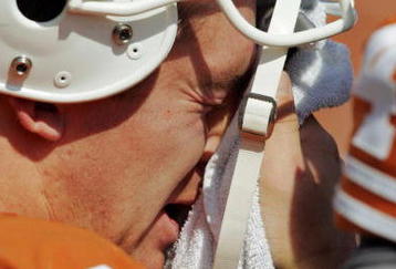 AUSTIN, TX - NOVEMBER 07:  Quarterback Colt McCoy #12 of the Texas Longhorns wipes his face during a review against the UCF Knights in the fourth quarter on November 7, 2009 at Darrell K Royal - Texas Memorial Stadium in Austin, Texas.  Texas won 35-3.  (Photo by Brian Bahr/Getty Images)