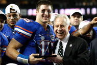 ATLANTA - DECEMBER 06:  Quarterback Tim Tebow #15 of the Florida Gators receives the Most Valuable Player award from SEC Commissioner Mike Slive after the Gators 31-20 win over the Alabama Crimson Tide in the SEC Championship on December 6, 2008 at the Georgia Dome in Atlanta, Georgia.  (Photo by Kevin C. Cox/Getty Images)