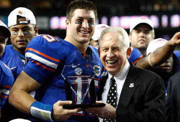 ATLANTA - DECEMBER 06:  Quarterback Tim Tebow #15 of the Florida Gators receives the Most Valuable Player award from SEC Commissioner Mike Slive after the Gators 31-20 win over the Alabama Crimson Tide in the SEC Championship on December 6, 2008 at the Georgia Dome in Atlanta, Georgia.  (Photo by Kevin C. Cox/Getty Images)