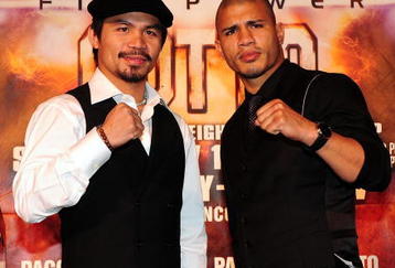 BEVERLY HILLS, CA - SEPTEMBER 14:  Manny Pacquiao and  Miguel Cotto pose for pictures during the press conference at the Beverly Hills Hotel on September 14, 2009 in Beverly Hills, California.  (Photo by Jacob De Golish/Jacob De Golish)