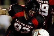 LUBBOCK, TX - NOVEMBER 01: Colby Whitlock #93 of the Texas Tech Red Raiders tackles Chris Ogbonnaya #3 of the Texas Longhorns in the Longhorns endzone for a safety during the first half of the game on November 1, 2008 at Jones Stadium in Lubbock, Texas. (Photo by Jamie Squire/Getty Images)