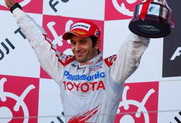 SUZUKA, JAPAN - OCTOBER 04:  Jarno Trulli of Italy and Toyota celebrates on the podium after finishing second during the Japanese Formula One Grand Prix at Suzuka Circuit on October 4, 2009 in Suzuka, Japan.  (Photo by Mark Thompson/Getty Images)