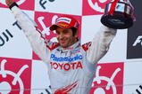 SUZUKA, JAPAN - OCTOBER 04:  Jarno Trulli of Italy and Toyota celebrates on the podium after finishing second during the Japanese Formula One Grand Prix at Suzuka Circuit on October 4, 2009 in Suzuka, Japan.  (Photo by Mark Thompson/Getty Images)
