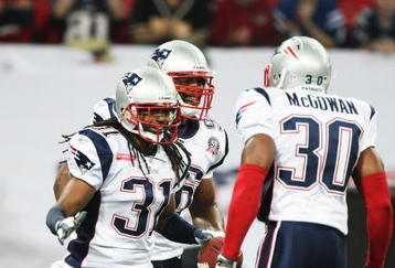 LONDON, ENGLAND - OCTOBER 25:  Brandon Meriweather (#31) of the New England Patriots celebrates scoring a touchdown with teamate Brandon McGowan (#30) of the New England Patriots during the NFL International Series match between New England Patriots and Tampa Bay Buccaneers at Wembley Stadium on October 25, 2009 in London, England. This is the third occasion where a regular season NFL match has been played in London.  (Photo by Elsa/Getty Images)