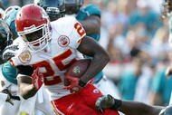 JACKSONVILLE, FL - NOVEMBER 08:  Running back Jamaal Charles #25 of the Kansas City Chiefs gets wrapped up while taking on the Jacksonville Jaguars at Jacksonville Municipal Stadium on November 8, 2009 in Jacksonville, Florida. The Jaguars defeated the Chiefs 24-21.  (Photo by Doug Benc/Getty Images)