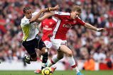 LONDON, ENGLAND - OCTOBER 31:  Nicklas Bendtner of Arsenal is challenged by Benoit Assou-Ekotto of Tottenham Hotspur during the Barclays Premier League match between Arsenal and Tottenham Hotspur at the Emirates Stadium on October 31, 2009 in London, England.  (Photo by Shaun Botterill/Getty Images)