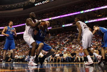 PHILADELPHIA - APRIL 26:  Reggie Evans #33 of the Philadelphia 76ers battles for the ball against Marcin Gortat #13 of the Orlando Magic during Game Four of the Eastern Conference Quarterfinals during the 2009 NBA Playoffs at the Wachovia Center on April 26, 2009 in Philadelphia, Pennsylvania. NOTE TO USER: User expressly acknowledges and agrees that, by downloading and/or using this Photograph, user is consenting to the terms and conditions of the Getty Images License Agreement.  (Photo by Jim McIsaac/Getty Images)