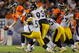 DENVER - NOVEMBER 09: Kyle Orton #8 of the Denver Broncos tries to get rid of the ball as he is pressured by the Pittsburgh Steelers at Invesco Field at Mile High on November 09, 2009 in Denver, Colorado. (Photo by Doug Pensinger/Getty Images)