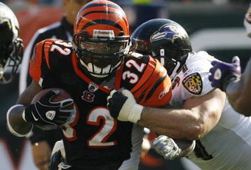 CINCINNATI - NOVEMBER 8: Cedric Benson #32 of the Cincinnati Bengals is tackled by Kelly Gregg #97 of the Baltimore Ravens at Paul Brown Stadium on November 8, 2009 in Cincinnati, Ohio.  (Photo by John Sommers II/Getty Images)
