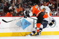 PHILADELPHIA, PA - NOVEMBER 07: Ole-Kristian Tollefsen #55 of The Philadelphia Flyers checks David Perron #57 of the St. Louis Blues during their game on November 7, 2009 at The Wachovia Center in Philadelphia, Pennsylvania. (Photo by Al Bello/Getty Images)