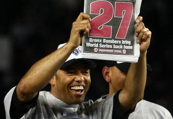 NEW YORK - NOVEMBER 04:  Mariano Rivera #42 of the New York Yankees holds up a copy of the New York Post as he celebrates their 7-3 win against the Philadelphia Phillies in Game Six of the 2009 MLB World Series at Yankee Stadium on November 4, 2009 in the Bronx borough of New York City.  (Photo by Chris McGrath/Getty Images)