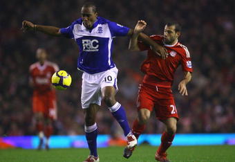 LIVERPOOL, ENGLAND - NOVEMBER 09:  Javier Mascherano of Liverpool battles for the ball with Cameron Jerome of Birmingham City, prior to Jerome scoring his team's second goal during the Barclays Premier League match between Liverpool and Birmingham City at Anfield on November 9, 2009 in Liverpool, England.  (Photo by Alex Livesey/Getty Images)