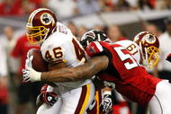 ATLANTA - NOVEMBER 08: John Abraham #55 of the Atlanta Falcons tackles Ladell Betts #46 of the Washington Redskins at Georgia Dome on November 8, 2009 in Atlanta, Georgia. (Photo by Kevin C. Cox/Getty Images)