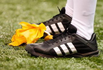 NEW ORLEANS - NOVEMBER 07:  A referee stands over a yellow penalty flag during a game between the UTEP Miners and the Tulane Green Wave at Louisana Superdome on November 7, 2009 in New Orleans, Louisiana.  (Photo by Ronald Martinez/Getty Images)