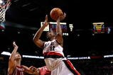PORTLAND, OR - OCTOBER 27:  LaMarcus Aldridge #12 of the Portland Trail Blazers shoots over Carl Landry #14 of the Houston Rockets during the season opener on October 27, 2009 at the Rose Garden in Portland, Oregon. NOTE TO USER: User expressly acknowledges and agrees that, by downloading and or using this Photograph, user is consenting to the terms and conditions of the Getty Images License Agreement.  (Photo by Jonathan Ferrey/Getty Images)