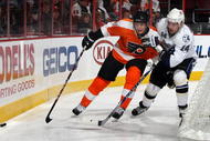 PHILADELPHIA - NOVEMBER 02: James van Riemsdyk #21 of the Philadelphia Flyers skates against Andrej Meszaros #14 of the Tampa Bay Lightning on November 2, 2009 at Wachovia Center in Philadelphia, Pennsylvania. (Photo by Jim McIsaac/Getty Images)
