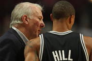 CHICAGO - OCTOBER 29: Head coach Gregg Popovich of the San Antonio Spurs talks with George Hill #3 during a game against the Chicago Bulls at the United Center on October 29, 2009 in Chicago, Illinois. The Bulls defeated the Spurs 92-85. (Photo by Jonathan Daniel/Getty Images)