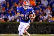 GAINESVILLE, FL - NOVEMBER 7: Quarterback Tim Tebow #15 of the Florida Gators rushes upfield against the Vanderbilt Commodores  November 7, 2009 at Ben Hill Griffin Stadium in Gainesville, Florida.  (Photo by Al Messerschmidt/Getty Images)