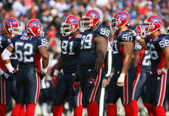 ORCHARD PARK, NY - NOVEMBER 01:  Marcus Stroud #99 of the Buffalo Bills stands on the field with teammates during the game against the Houston Texans at Ralph Wilson Stadium on November 1, 2009 in Orchard Park, New York. Houston won 31-10. (Photo by Rick Stewart/Getty Images)