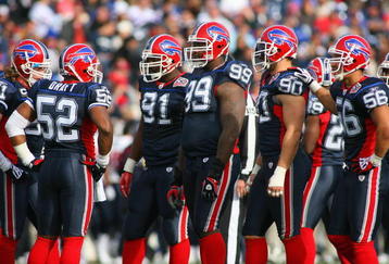 ORCHARD PARK, NY - NOVEMBER 01:  Marcus Stroud #99 of the Buffalo Bills stands on the field with teammates during the game against the Houston Texans at Ralph Wilson Stadium on November 1, 2009 in Orchard Park, New York. Houston won 31-10. (Photo by Rick Stewart/Getty Images)